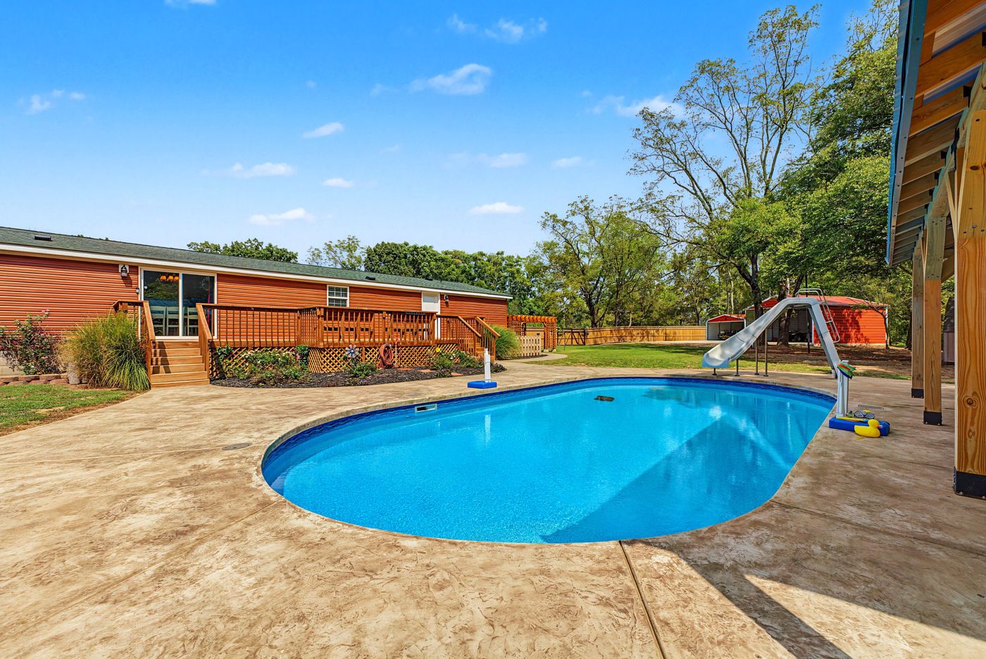 Backyard pool and deck at a Northwest Arkansas listing, photographed by 1440 Real Estate Media